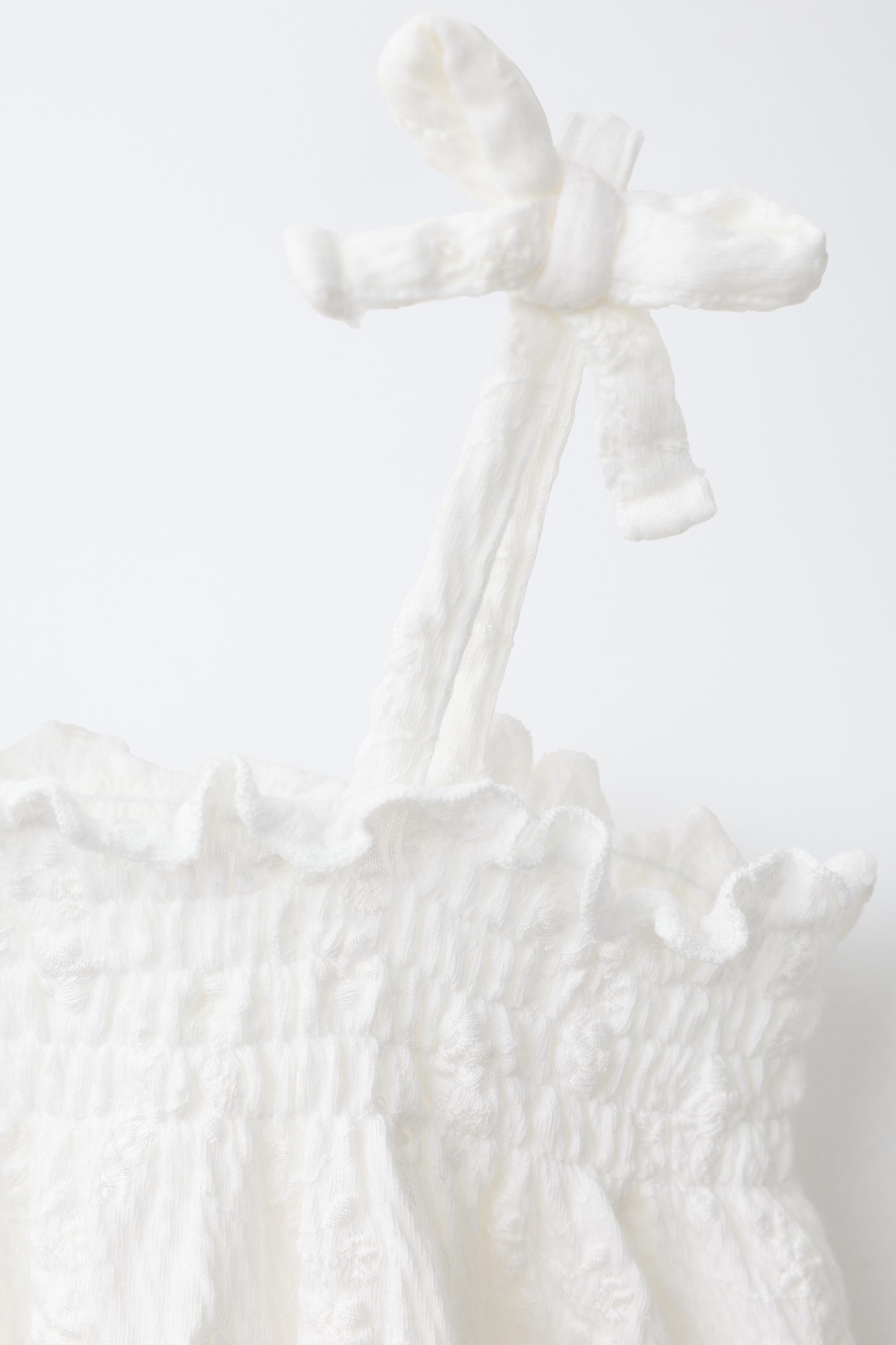 SALOPETTE BRODERIES ASSOCIÉES